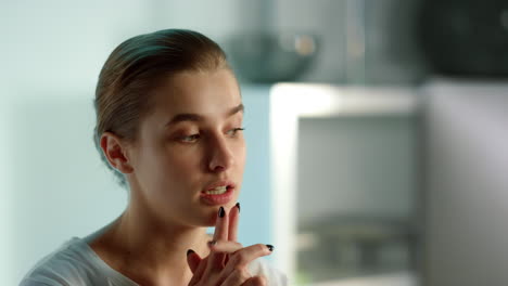 Pensive-lady-considering-problem-online-conference-with-colleagues-team-closeup.