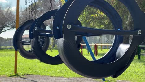 swings swaying in a playground in cape town, south africa