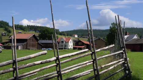 gimbal pan left shot of traditional village in jamtland on sunny day, sweden