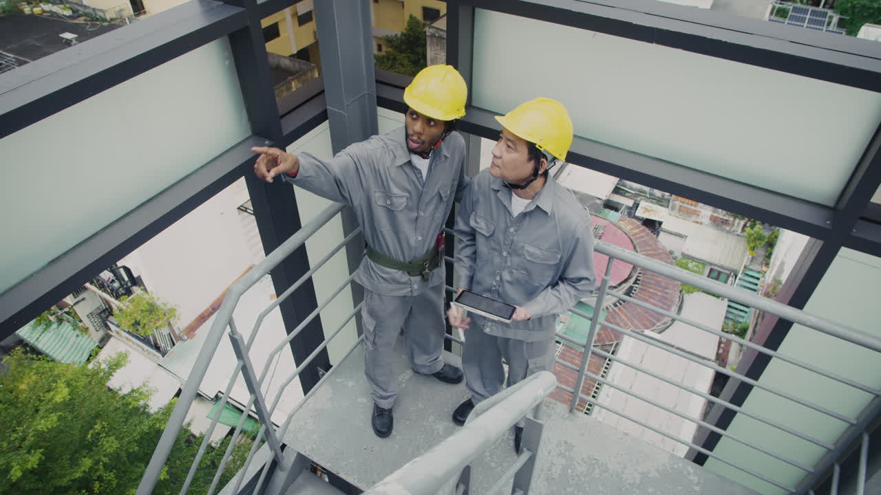 Diverse Engineers Discussing Stairs Construction Plan