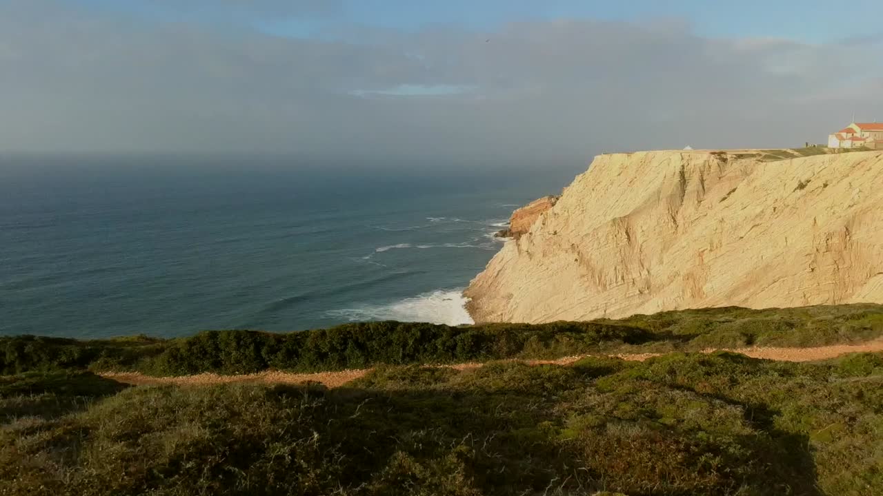 aerial reveal shot over the cliff, sesimbra