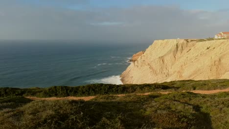 aerial-reveal-shot-over-the-cliff,-sesimbra