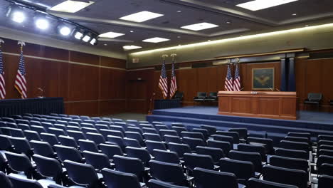 images of a press briefing room with podium and flags