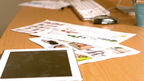 close up of a tablet, computer and some documents