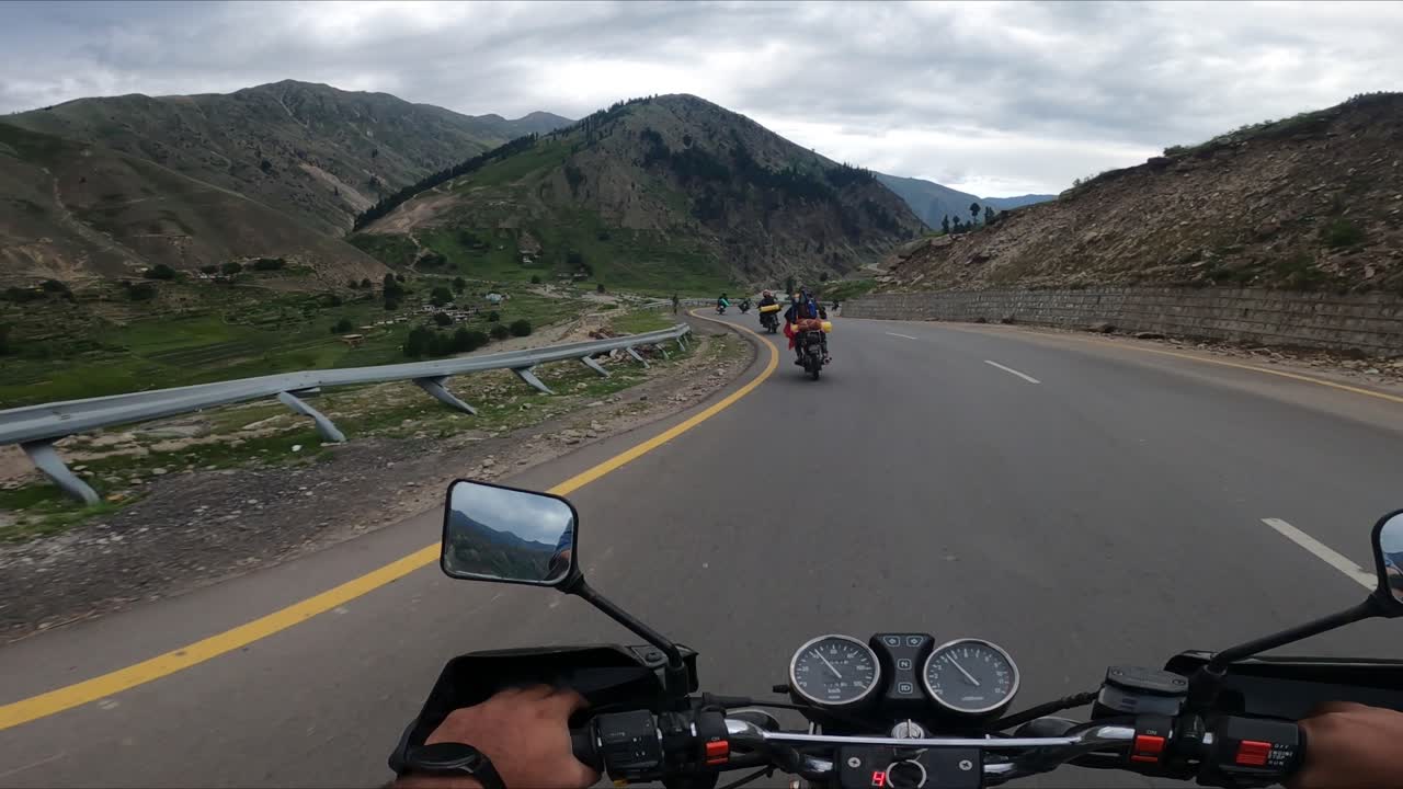 Motorbike rider outside Naran Kaghan Valley Northern Pakistan