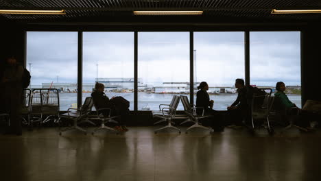 time lapse of people walking in the international airport at the departure gate.