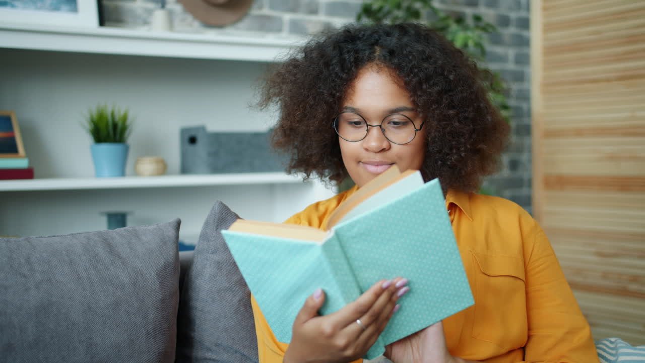 Young Woman Reading on a Couch