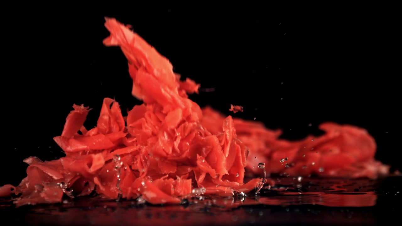 Pickled Ginger Falling in Slow Motion onto a Wet Surface