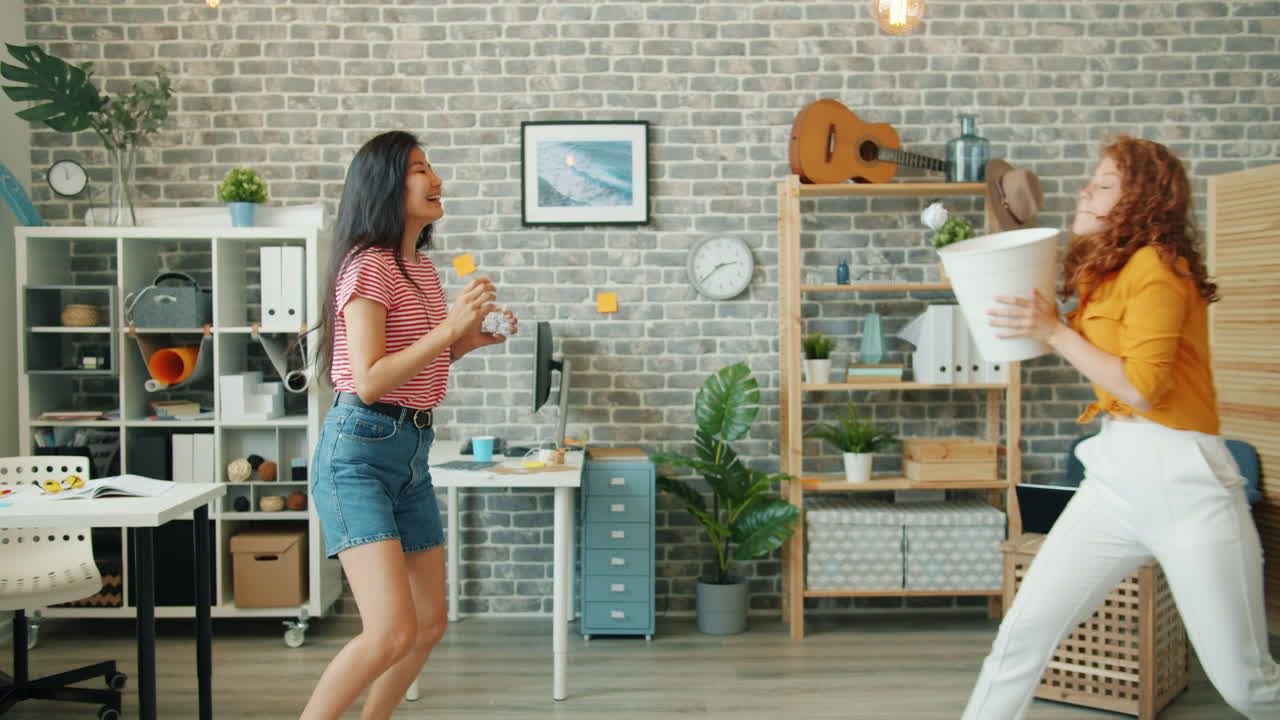 Two Women Having Fun in an Office Space