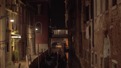 gondolier with gondola boats in venice italy