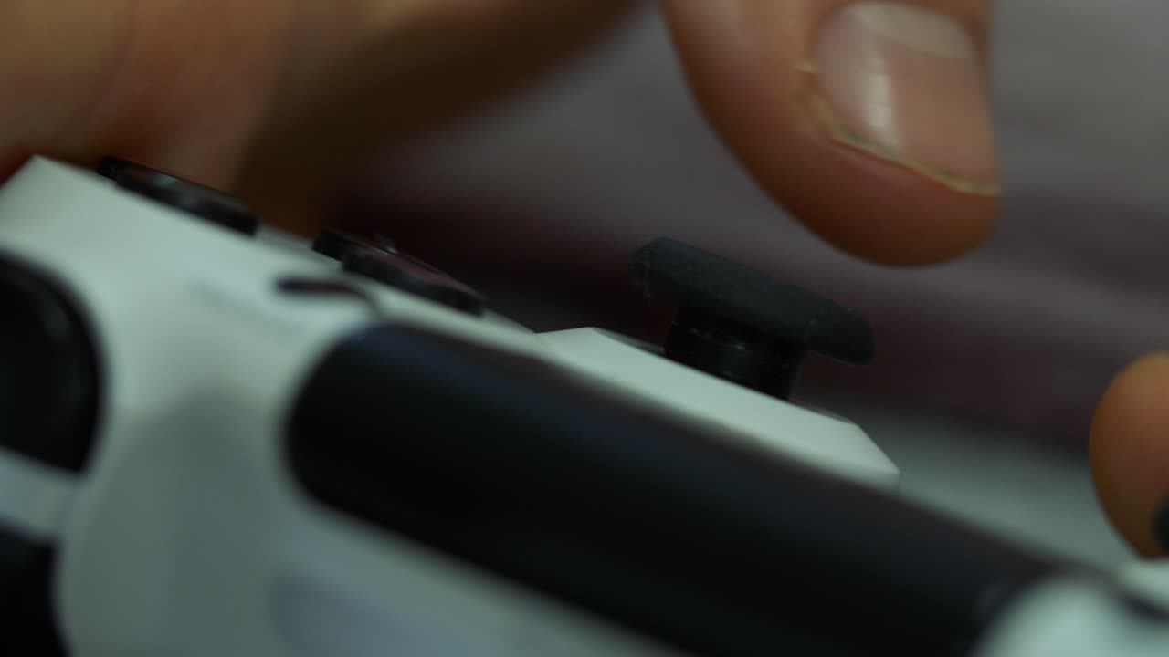Close-up of hand on gaming controller