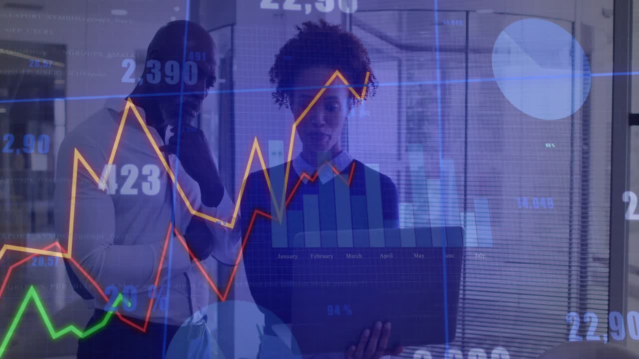Colleagues holding laptop initiating animated line and bar graphs for analyzing business trends