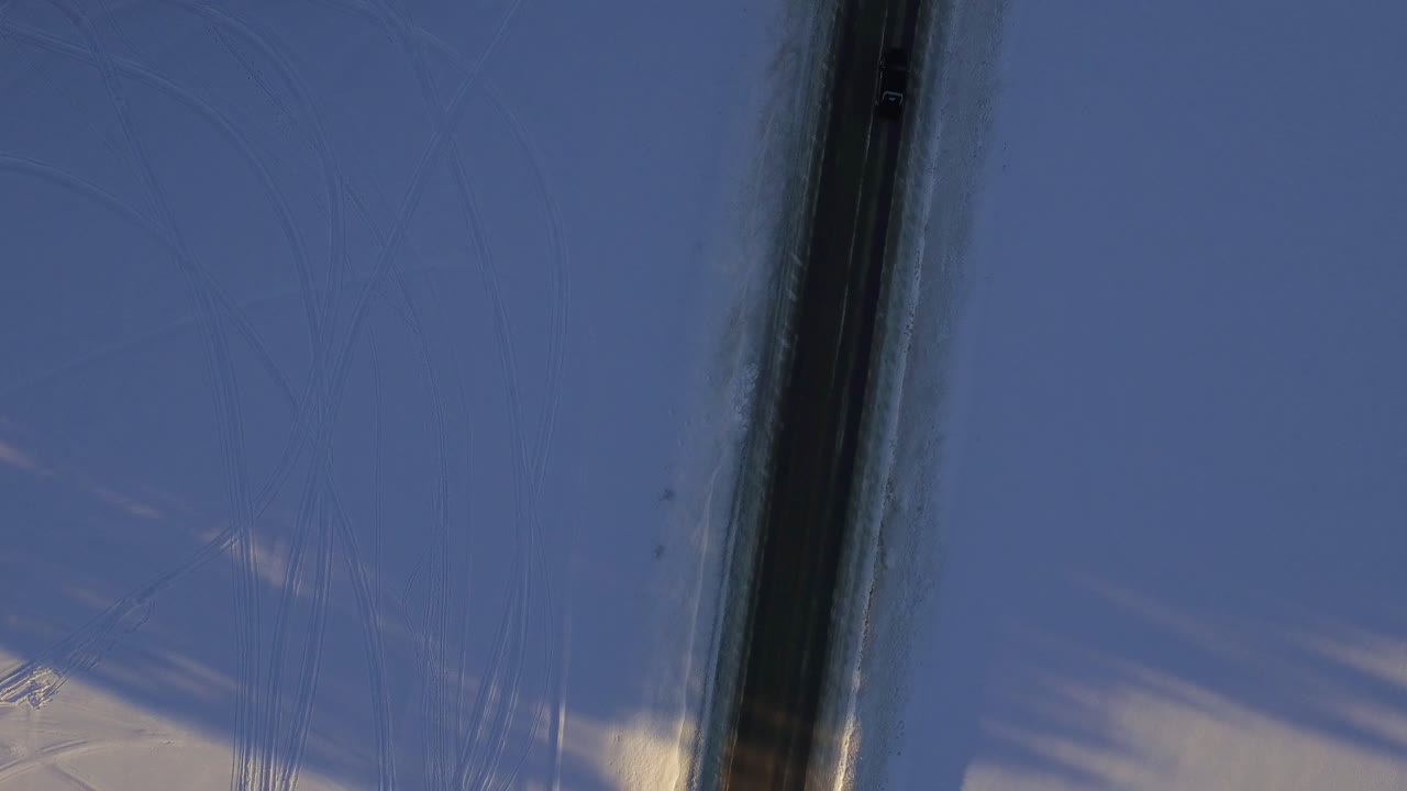 Snowy Road Through Forest