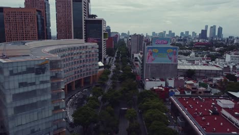 Ejercito-Nacional-Mexicano-Aveneu-in-a-drone-shot-next-to-Antara-shopping-mall-in-Polanco-area,-Mexico-City