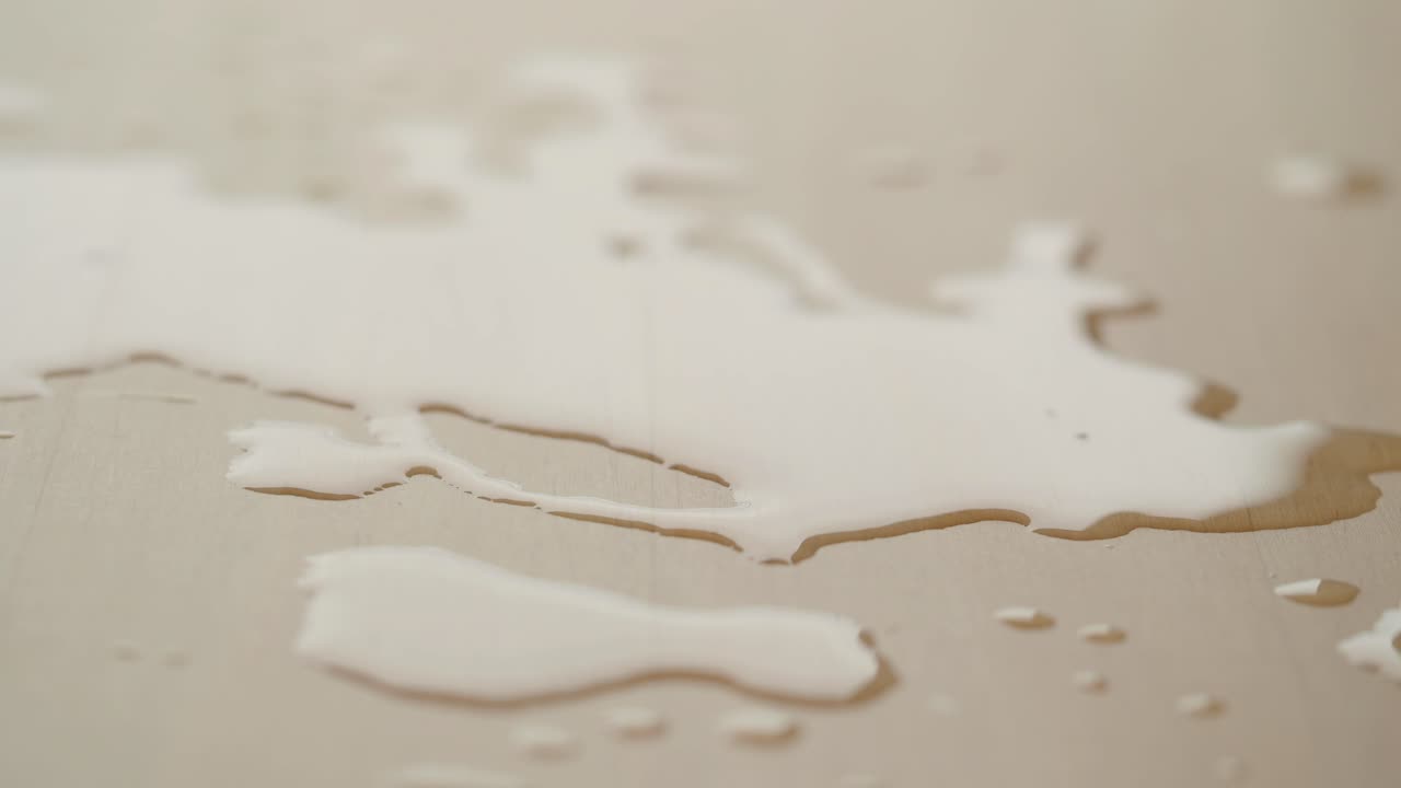 Water Stains on a Light-Beige Wooden Surface