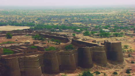 aerial flight over the the historically-significant derawar fort, enormous and impressive structure in the heart of the cholistan desert, located south of the city of bahawalpur, pakistan