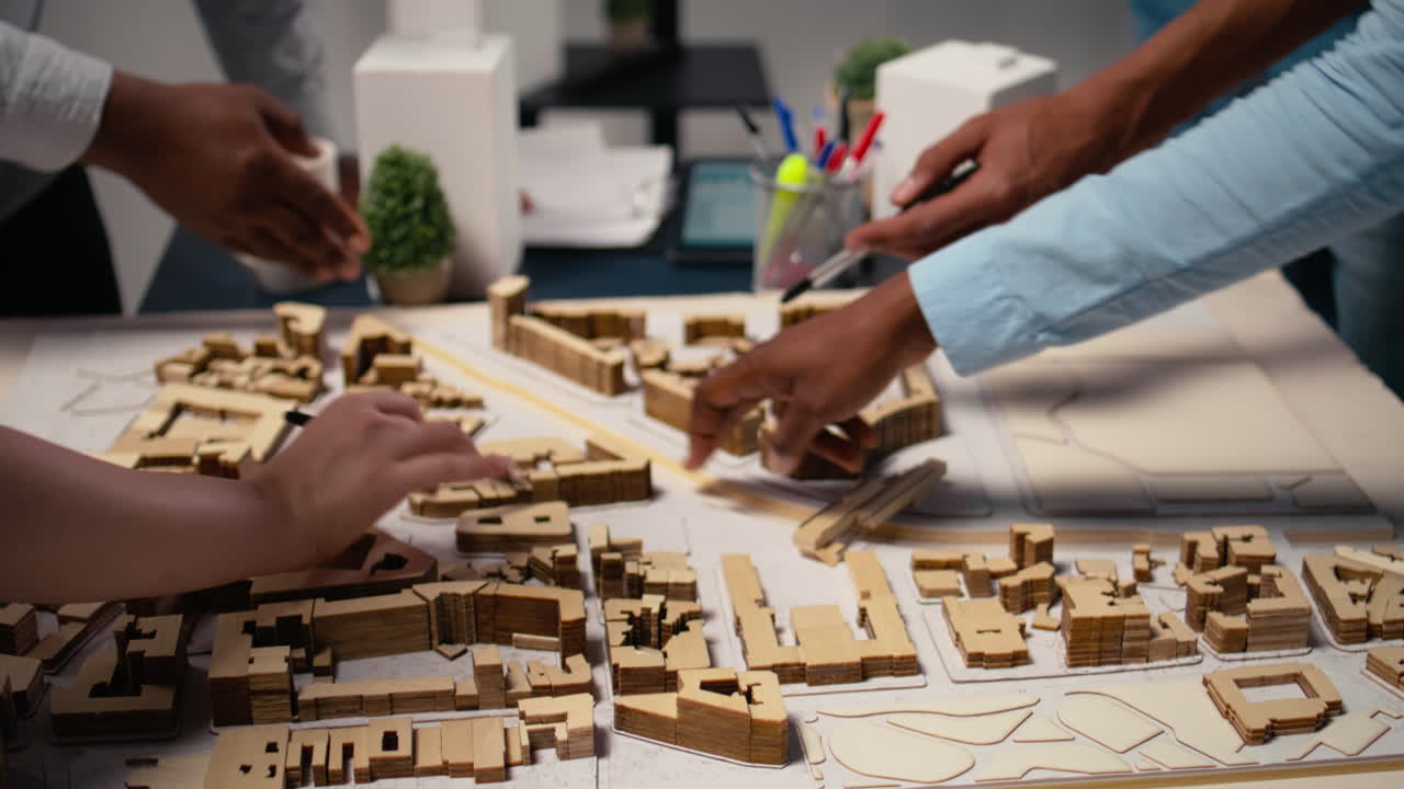 Close up of engineers team creating the property layout for site preparation