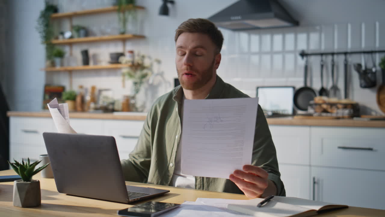 Busy manager reading documents at home office looking overloaded closeup