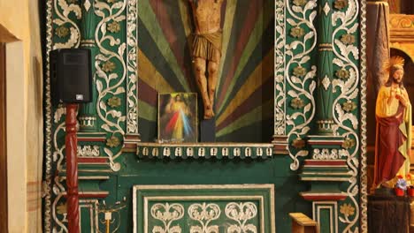 Panning-shot-of-Jesus-Christ-statue-fixed-in-the-wall-of-Jesuit-Missions-of-Chiquitos-,-Bolivia