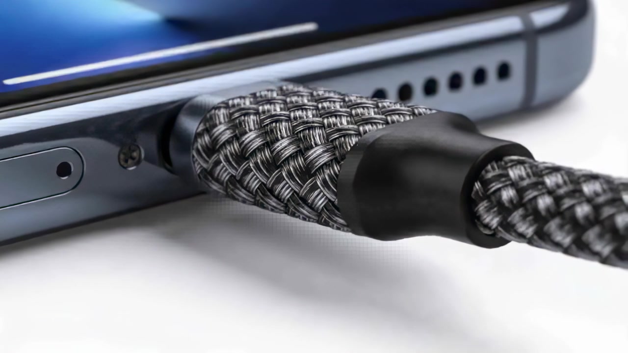Pushing braided cable into phone bottom port for charging in studio, rubber collar seating flush