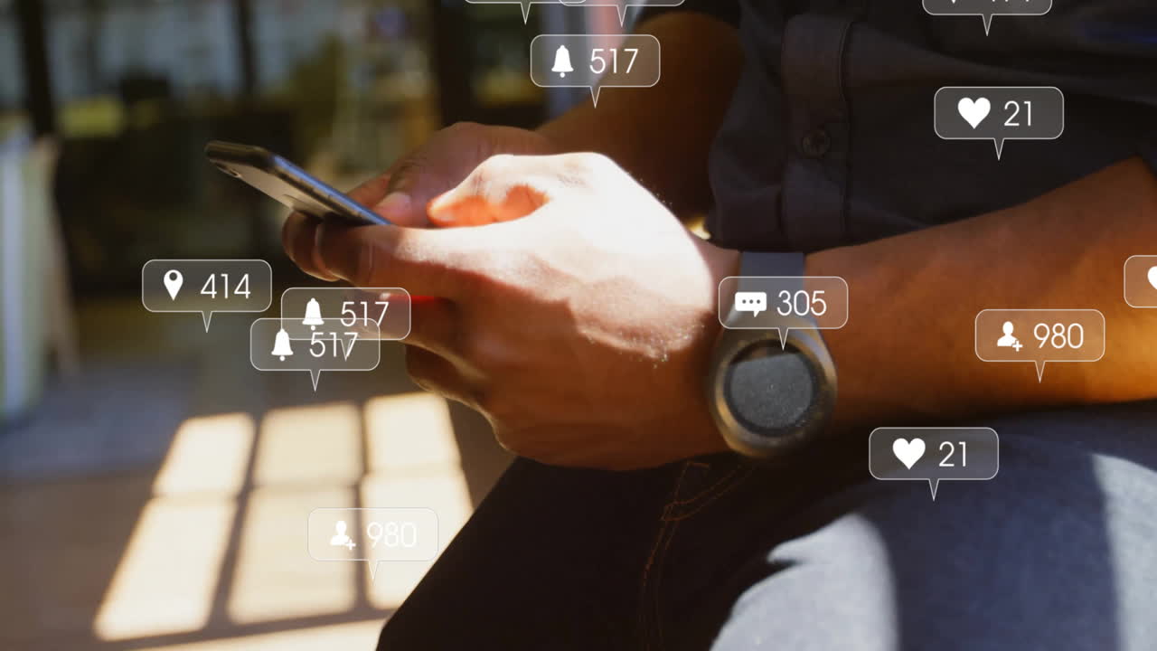 Animation of social media icons with numbers over caucasian man using smartphone