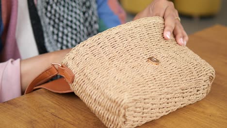 close-up of a brown woven straw bag