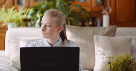 Beautiful-Thoughtful-Concerned-Woman-Working-On-Laptop-1