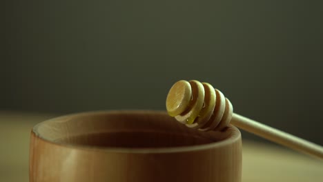 wooden bowl. close-up. healthy organic, wooden honey spoon, closeup.