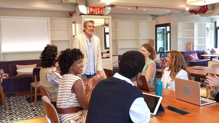 Diverse Professional Team Applauding During Office Meeting
