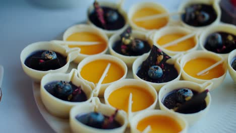 Different-colorful-delicious-desserts-at-buffet,-rack-focus-closeup