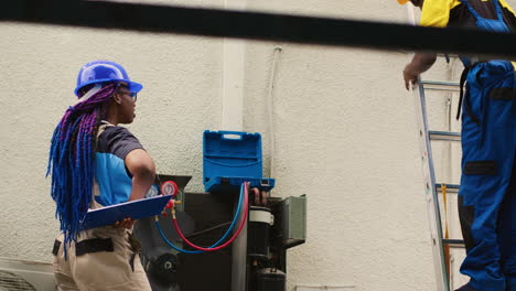 diverse team checking hvac system