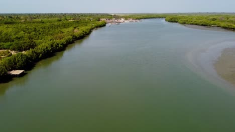 Aerial-pull-out-view-of-River-Gambia-shot-at-Stala-Adventures,-Kartong---The-Gambia