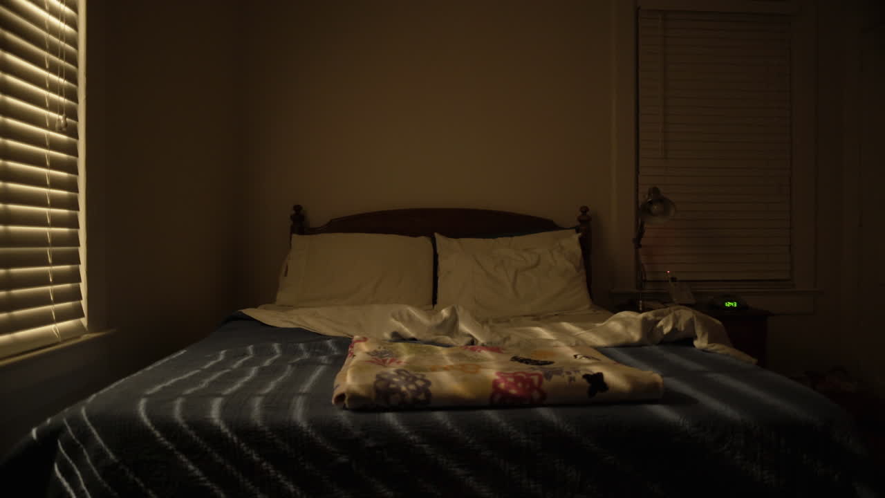 Queen Sized Bed in Dark Bedroom at Night, Interior, Wide Static Shot