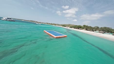 Fly-Over-Turquoise-Seascape-With-Floating-Luxury-Ships-At-Playa-La-Ensenada-In-The-Dominican-Republic