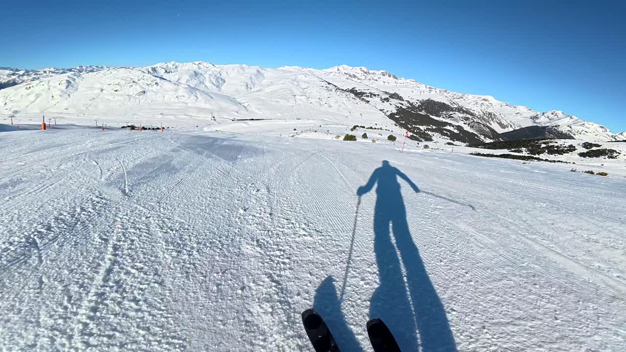 Skiing down a snowy mountain slope