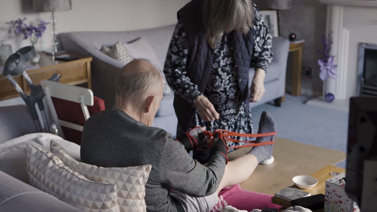 Elderly couple exercising at home