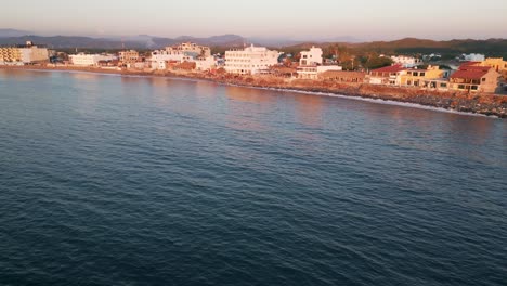 Aerial-of-Barra-de-Navidad-Jalisco-Mexico-pacific-coastline-at-sunset