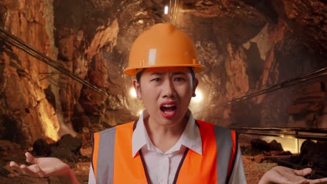 woman worker in a mine tunnel expressing frustration
