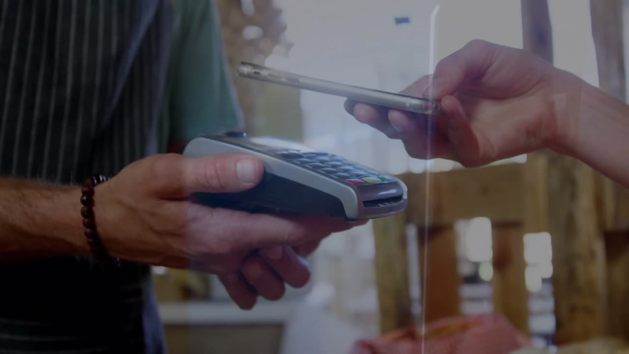 Animation of data processing over caucasian woman paying with smartphone
