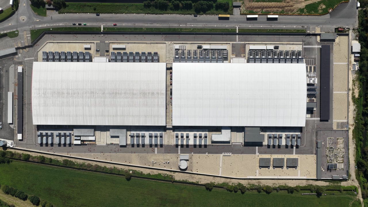 data center in Milan, Italy, fiber network, cloud computing, industrial IT infrastructure. AI and internet tech. Cloud storage, co location and super computing. Aerial view of facility.