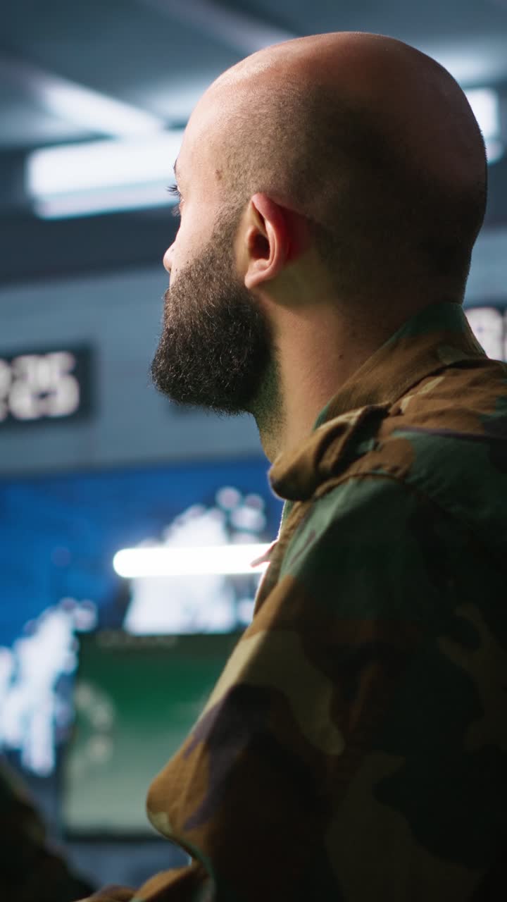 Vertical video Soldier doing tasks in military base, doing surveillance with radar equipment