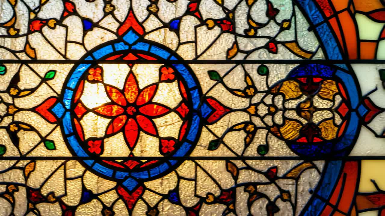 After holding focus on floral motif camera panning, revealing adjacent glass panels in interior