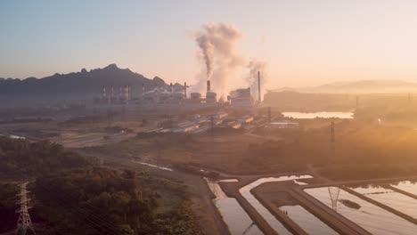 Beautiful Landscape coal power plant in the morning time with fog.