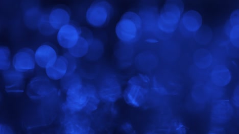 movimiento abstracto de luces desfocalizadas azules. parpadeando y ondulando bokeh azul.