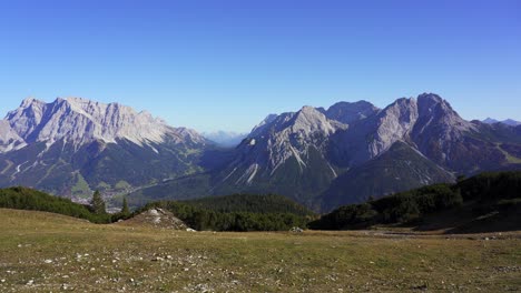 panning view of zugspitze and sonnenspitze mountains in the alps of austria