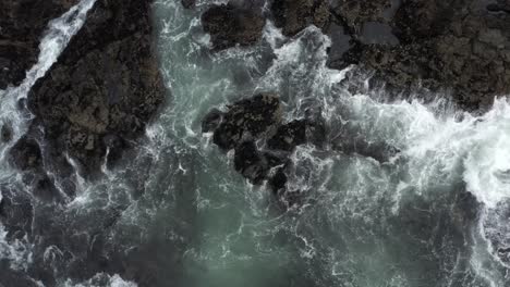 Ascending-On-Rocks-And-Waves-In-Tofino-Beach,-Vancouver-Island,-Canada