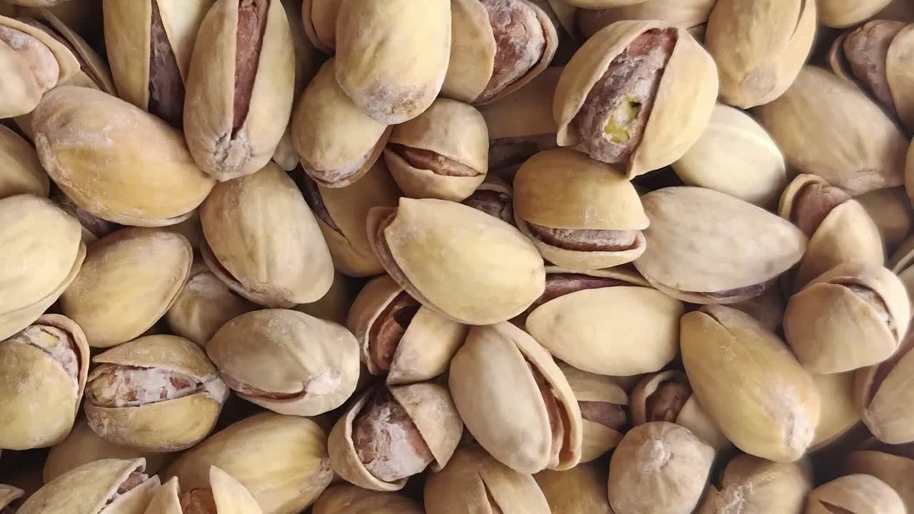 Healthy, pistachio rotates as background