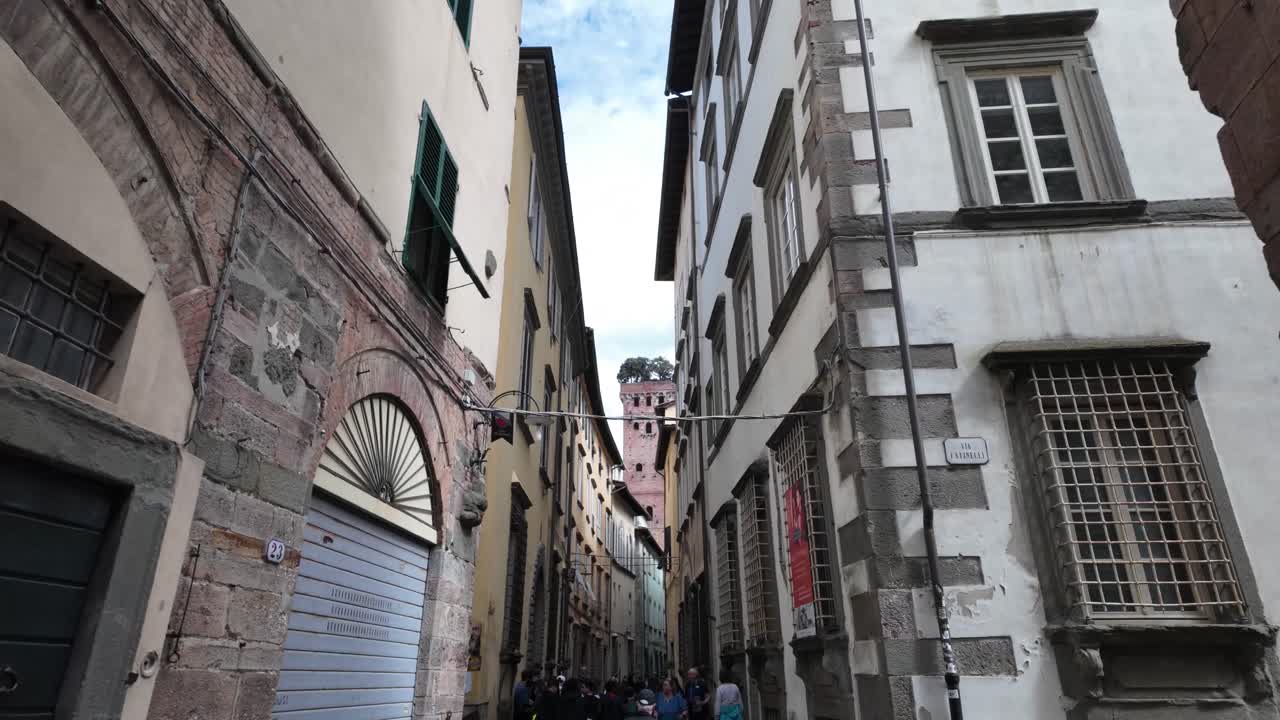 Narrow busy Italian street Lucca Italy beautiful touristic alleyway