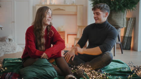 Man-and-women-talking-with-each-other-while-sitting-at-home