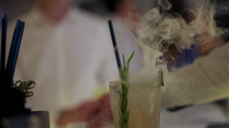 Bartender-Preparing-Dry-Ice-Drink-At-Club